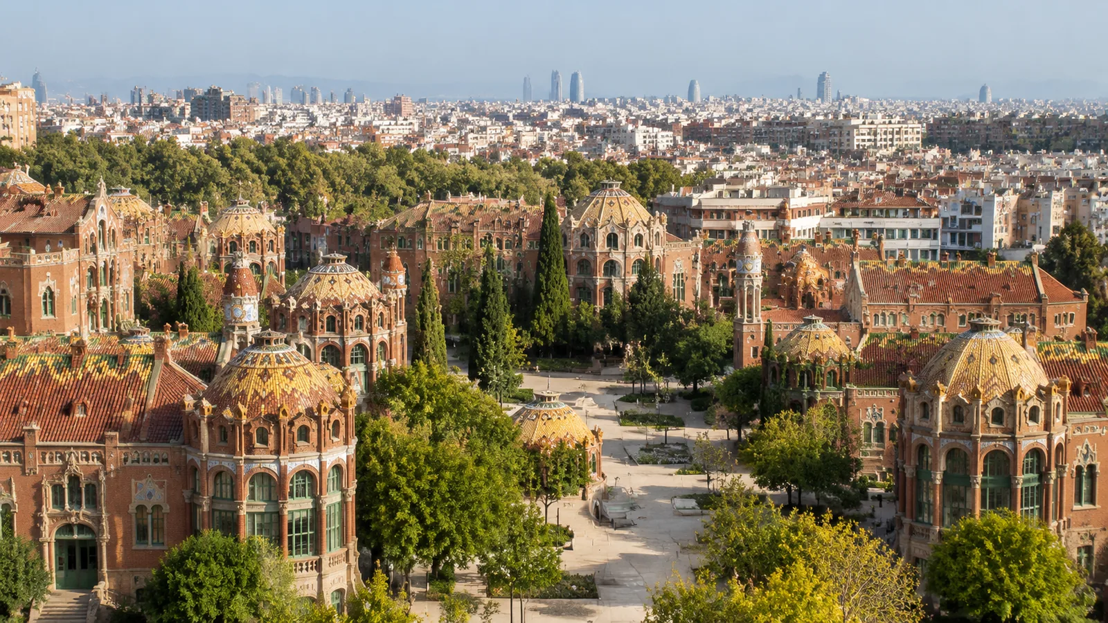 Tiled pavilion domes of the Sant Pau garden-city complex seen from above