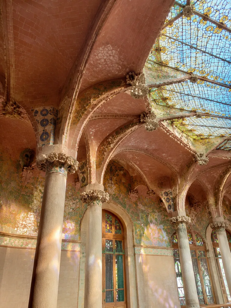 Stained-glass ceiling and tiled vaults inside a Sant Pau pavilion